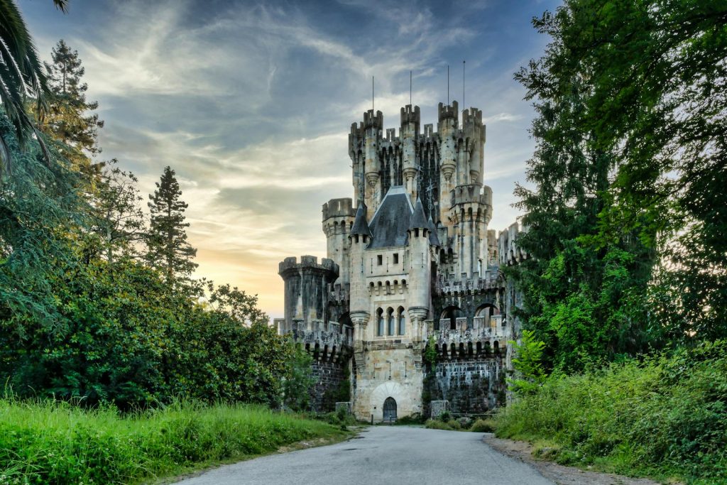 Explore the majestic Butrón Castle surrounded by lush greenery in Gatika, Basque Country, Spain.