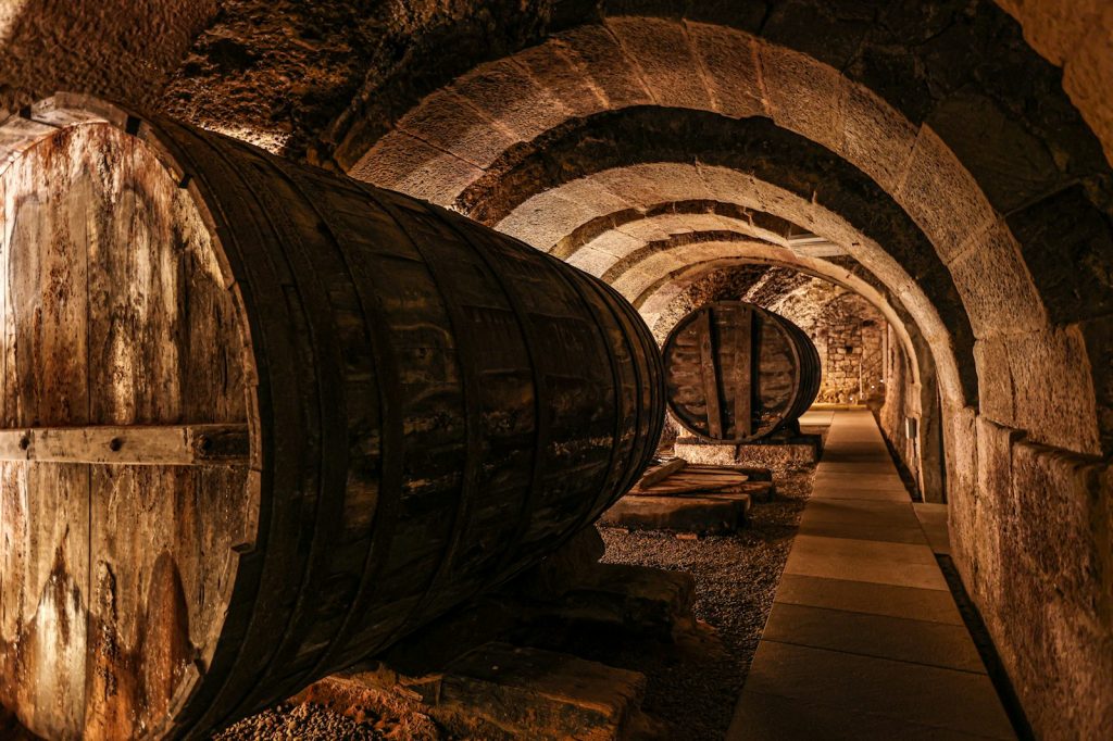 a stone tunnel with a walkway